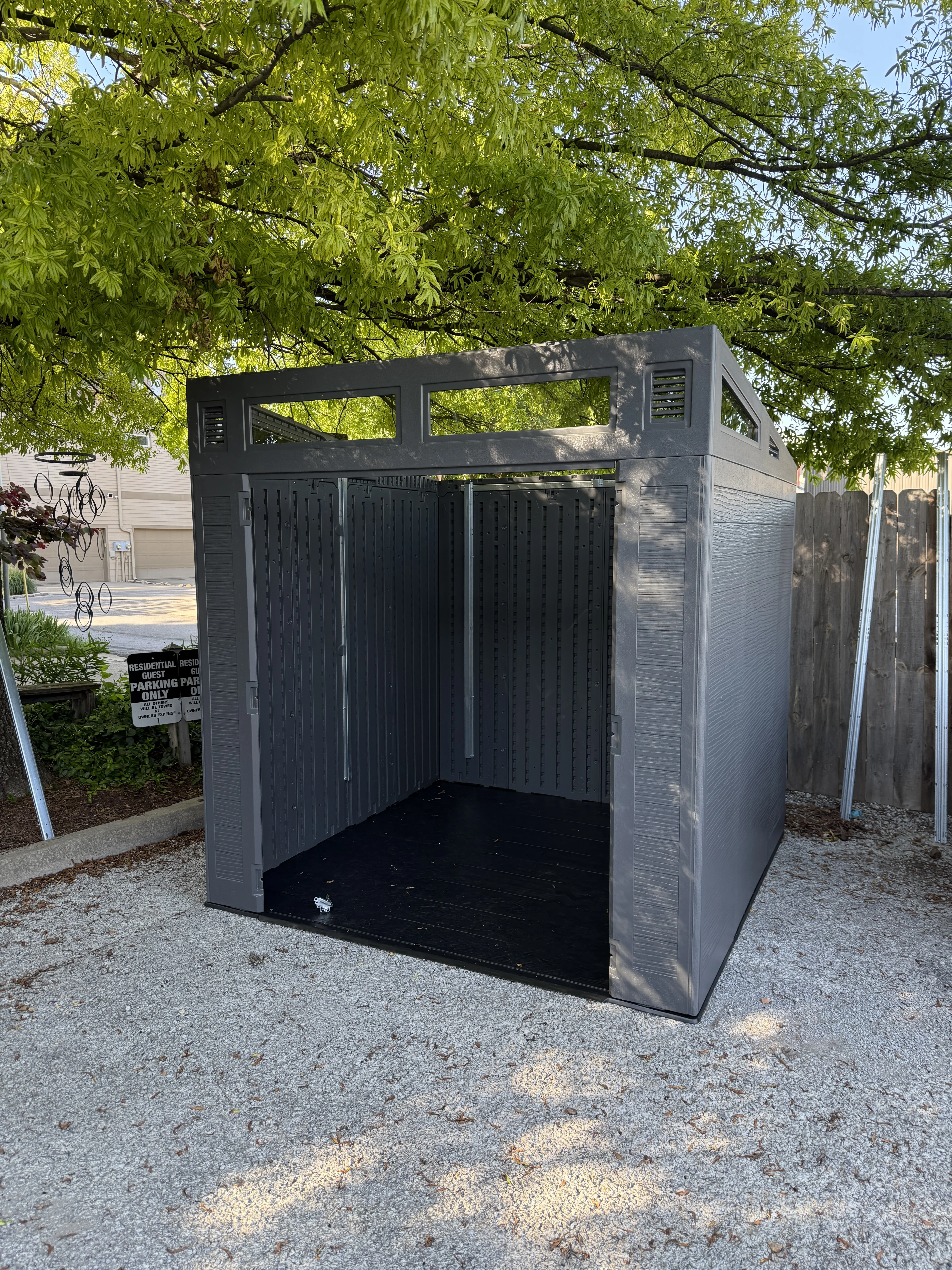 Open interior of the storage shed before items are organized inside